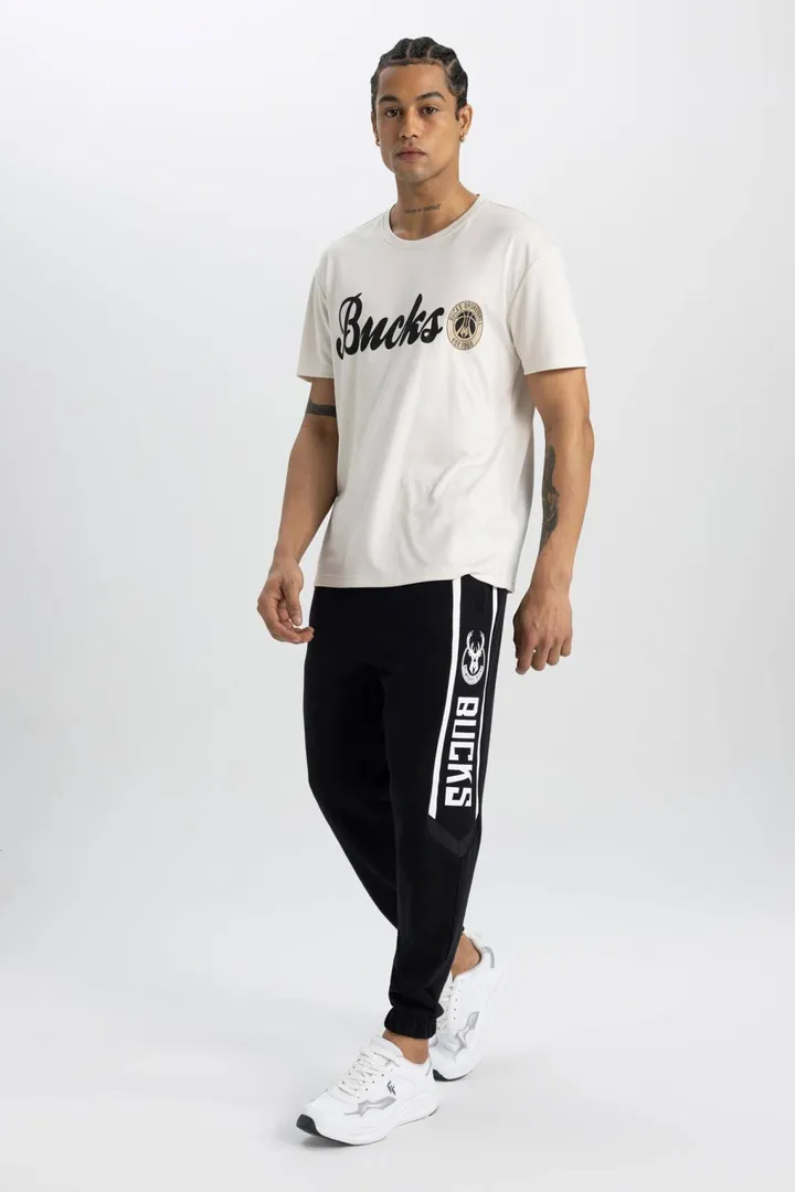 <span class="text-styled__StyledSpan-sc-d280c10c-1 dvOaRP">Defacto< span>DeFactoFit NBA Milwaukee Bucks Standard Fit Jogger