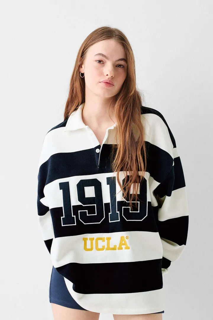 <span class="text-styled__StyledSpan-sc-d280c10c-1 dvOaRP">Bershka< span>سویشرت UCLA با یقه پولو دوزی شده