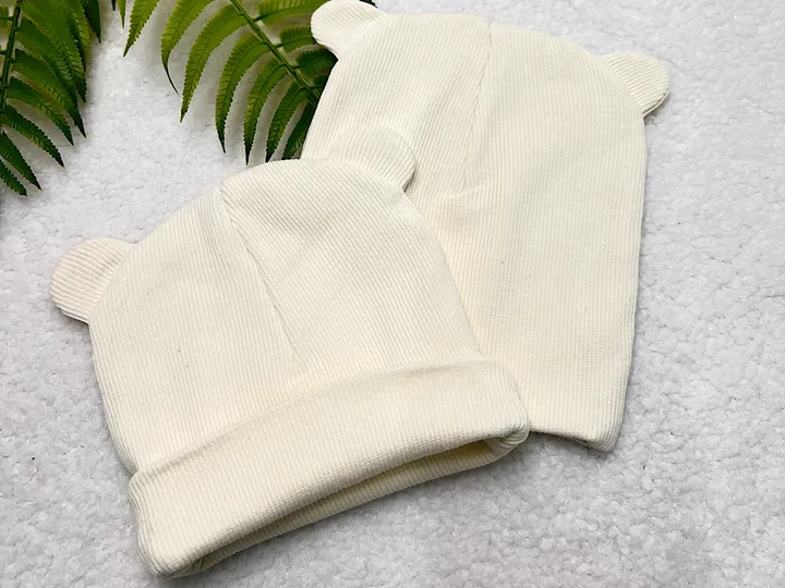 کلاه دو لایه  گرد گوش دار کبریتی نوزادی رنگ شیری