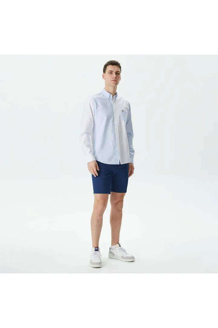 <span class="text-styled__StyledSpan-sc-d280c10c-1 dvOaRP">Lacoste< span>مردانه اسلیم فیت آبی برمودای آبی